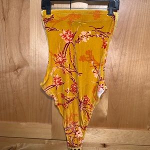 Velvet yellow Urban Outfitters bodysuit.